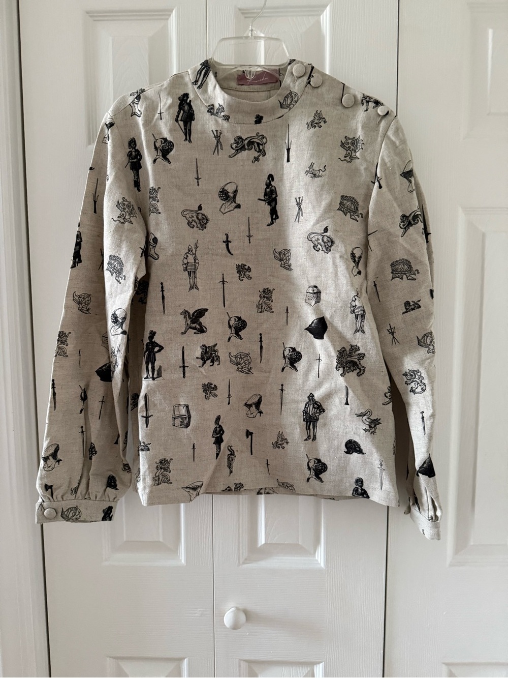 Kaneko linen top with graphic print medieval heraldry armor sword griffin gothic